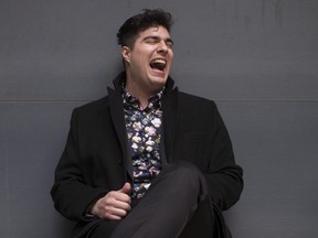 Singer Jeremy Dutcher poses in Toronto on Tuesday, April 10, 2018. The singer is a member of the Tobique First Nation in New Brunswick, and his new album "Wolastoqiyik Lintuwakonawa" has him singing alongside music and vocals made on wax recordings 110 years ago in the now dying Wolastoq language.