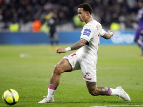Lyon's Memphis Depay controls the ball during their French League One soccer match against Toulouse in Decines, near Lyon, central France, Sunday, April 1, 2018.