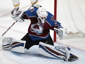 Colorado Avalanche goaltender Jonathan Bernier makes a pad save of a shot by the Nashville Predators during the first period of Game 4 of an NHL hockey first-round playoff series Wednesday, April 18, 2018, in Denver.