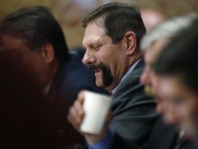 In this Thursday, March 8, 2018, photo, Colorado State Senator Randy Baumgardner, R-Hot Sulphur Springs, listens to debate on a concealed carry bill during action on the floor of the chamber in the State Capitol in Denver. The Republican-led Senate has agreed to debate a Democratic resolution calling for the expulsion of Baumgardner, who is accused of inappropriately touching a former legislative aide.