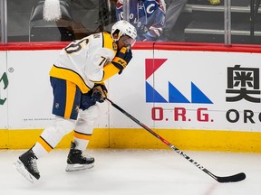 Nashville Predators defenseman P.K. Subban grabs his face after being hit during the first period in Game 6 of an NHL hockey first-round playoff series against the Colorado Avalanche, Sunday, April 22, 2018, in Denver.