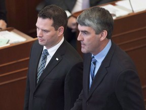 Premier Stephen McNeil introduces Derek Mombourquette, left, the new MLA from the riding of Sydney-Whitney Pier at the legislature in Halifax on Thursday, Nov. 12, 2015. Nova Scotia municipal councillors who are pregnant will be able to take maternity leave without penalty and without asking permission of their councils under proposed legislative changes.