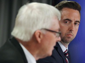 Newfoundland and Labrador Justice Minister Andrew Parsons (right) is shown at a news conference in St.John's on Tuesday, June 27, 2017. Newfoundland and Labrador is planning legislation that would let victims of so-called revenge porn seek compensation in civil court.