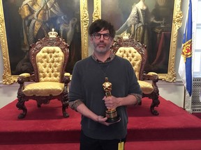 Set decorator Shane Vieau holds his Oscar in the Red Chamber at the Nova Scotia legislature in Halifax on Wednesday April 4, 2018. Vieau, a Dartmouth native, won the Oscar last month for best production design on the film that also won for best picture in 2017, The Shape of Water.