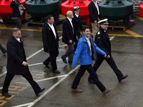 Prime Minister Justin Trudeau arrives to meet with Canadian Coast Guard members aboard the Sir Wilfrid Laurier to discuss marine safety and spill prevention, in Victoria on Thursday, April 5, 2018. An oil company CEO is harshly criticizing Trudeau as the prime minister tours the oilsands region of northeastern Alberta as part of a Western Canada trip to deliver a message supporting pipelines and the environment.