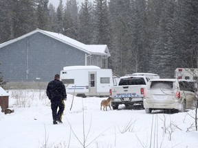RCMP attend the scene after an infant was found dead and 14 others were sent to Alberta Children's Hospital from a home on the Stoney Nakoda First Nation, 80 kilometres west of Calgary, Wednesday, April 4, 2018.