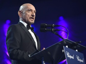 Ben Kingsley presents the Desert Palm Achievement actor award to Casey Affleck for "Manchester by the Sea" at the 28th annual Palm Springs International Film Festival Awards Gala on Monday, Jan. 2, 2017, in Palm Springs, Calif. Kingsley says he tried "very hard" not to judge his character, a fugitive war criminal, in the film "An Ordinary Man."