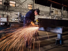 A worker uses a grinder on a steel at George Third & Son Steel Fabricators and Erectors, in Burnaby, B.C., on March 29, 2018. The economy delivered 32,300 net new jobs last month as Canada generated a rush of full-time work that helped keep the national unemployment rate at its record low.Statistics Canada said Friday the jobless rate stayed at 5.8 per cent in March for a second-consecutive month - and for the third time since December - to match its lowest mark since the agency started measuring the indicator in 1976. The only other time the rate slipped to this level was 2007.