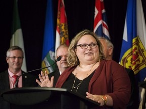 Alberta Health Minister Sarah Hoffman answers questions during a federal, provincial and territorial health ministers' meeting in Toronto on Tuesday, October 18, 2016. Alberta health minister Sarah Hoffman says the government will bring in legislation in the coming days to establish no-go zones for protesters around abortion clinics.