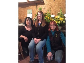 Humboldt Florist owner Kathy Poppel, centre, along with staff members Ruth Brinkman, left, and Wendy Wegleitner pose for a photo in this recent handout photo. Humboldt Florist staff memebers have been working non-stop to fill orders from around the world after the Humboldt Broncos bus tragedy.