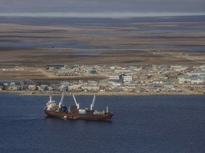 A cargo ship sits in the bay at Cambridge Bay Nunavut, on September 2, 2017. The United Nations group which regulates the international shipping industry is being asked to cut emissions from the cargo ships, oil tankers and other vessels that criss cross the world's oceans as they threaten to become the single-largest source of planet-warming greenhouse gases. Canada however is being strangely secretive about what it wants to see done to cut emissions from international shipping ahead of a meeting in the United Kingdom next week to try and set some targets.