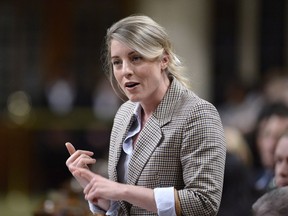 Minister of Canadian Heritage Melanie Joly rises during Question Period in the House of Commons on Parliament Hill in Ottawa on April 19, 2018. Canadian Heritage Minister Melanie Joly says cultural organizations that apply for or receive federal funding will have to sign an agreement promising to provide a workplace free from harassment and sexual misconduct.