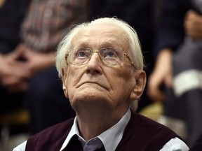 94-year-old former SS sergeant Oskar Groening looks up as he listens to the verdict of his trial Wednesday, July 15, 2015 at a court in Lueneburg, northern Germany. As a German Nazi SS officer during the Second World War, Oskar Groening worked as an accountant at the Auschwitz concentration camp in occupied Poland. But he didn't kill anyone nor sign orders to kill, according to his testimony at a high-profile 2015 trial, in which he was convicted as an accessory to the murder of 300,000 Jews. The new documentary ???The Accountant of Auschwitz??? explores Groening's case - looking at the complicity of him and other lower-level SS guards, and the debates surrounding their prosecution in the 1990s.