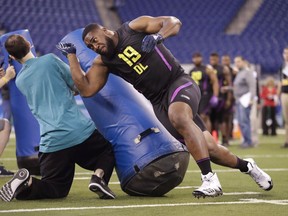 Fort Hays State defensive lineman Nathan Shepherd runs a drill at the NFL football scouting combine in Indianapolis, Sunday, March 4, 2018. Count NFL draft Mike Mayock as a fan of Canadian defensive tackle Nathan Shepherd. Mayock put Shepherd fourth among his top-five interior defensive linemen prospects leading up to next week's draft.
