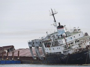 The cargo ship Kathryn Spirit is shown run aground on Lac Saint-Louis near Montreal, Thursday, November 10, 2016. A southwestern Quebec town is counting down the days until an unwelcome piece of marine history disappears from its shores. Officials say they hope the dismantling of the Kathryn Spirit proceeds smoothly after a fire a few weeks ago aboard the rusting cargo vessel parked off its shores.THE CANADIAN PRESS/Graham Hughes