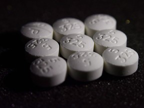 A report released today by the parliamentary budget officer says extended drug patent protections in the Canada-EU free trade deal could cost the government up to $270 million per year. It also estimates that higher drug prices could end up costing Canadians an additional $392 million a year. This Aug. 15, 2017 photo shows an arrangement of pills of the opioid oxycodone-acetaminophen in New York.