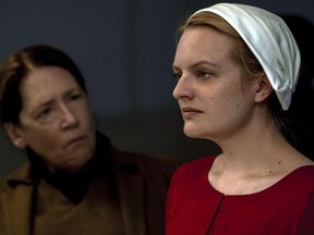 This image released by Hulu shows Ann Dowd, left, and Elisabeth Moss in a scene from the series, "The Handmaid's Tale," returning for a second season on April 25. Ann Dowd warns that you should never be too judgmental about the characters you play. THE CANADIAN PRESS/George Kraychyk/Hulu via AP)