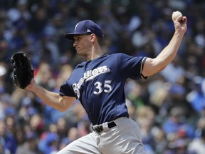 Milwaukee Brewers starting pitcher Brent Suter throws against the Chicago Cubs during the first inning of a baseball game Friday, April 27, 2018, in Chicago.