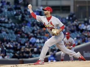 St. Louis Cardinals starting pitcher Adam Wainwright delivers during the first inning of the team's baseball game against the Chicago Cubs on Tuesday, April 17, 2018, in Chicago.
