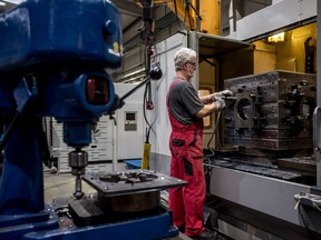 An employee works on the sheet-metal machine at the Baumruk and Baumruk factory near Plzen, Czech Republic, on Wednesday, March 28, 2018.