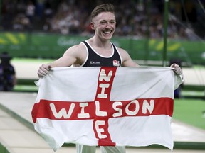 England's Nile Wilson celebrates during the men's individual artistic gymnastics competition at Coomera Indoor Stadium during the Commonwealth Games on the Gold Coast, Australia, Saturday, April 7, 2018.