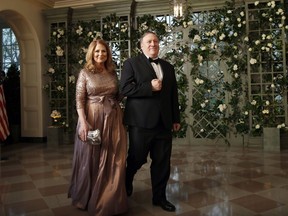 CIA director Mike Pompeo and his wife Susan Pompeo arrive for a State Dinner with French President Emmanuel Macron and President Donald Trump at the White House, Tuesday, April 24, 2018, in Washington.