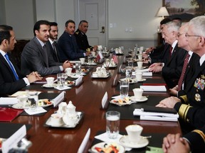 Defense Secretary Jim Mattis, third from right, and Emir of Qatar Sheikh Tamim bin Hamad al-Thani, second from left, participate in a bilateral meeting at the Pentagon, Monday, April 9, 2018.