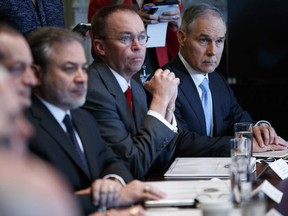 Environmental Protection Agency administrator Scott Pruitt, right, listens as President Donald Trump speaks during a cabinet meeting at the White House, Monday, April 9, 2018, in Washington.