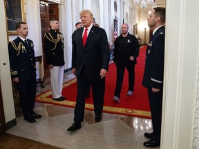 President Donald Trump arrives to speak at an event for the Wounded Warrior Project Soldier Ride in the East Room of the White House, Thursday, April 26, 2018, in Washington.