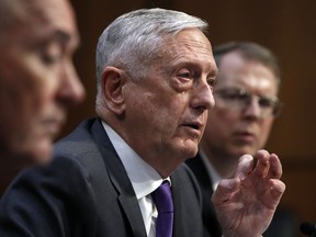 Defense Secretary Jim Mattis, center, attends a hearing on the Department of Defense budget posture, with Joint Chiefs Chairman Gen. Joseph Dunford, left, and Defense Under Secretary and Chief Financial Officer David Norquist, right, during a Senate Armed Services Committee hearing, Thursday April 26, 2018, on Capitol Hill in Washington.