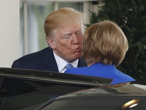 President Donald Trump greets German Chancellor Angela Merkel, Friday April 27, 2018, at the White House in Washington.