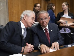 Senate Foreign Relations Committee Chairman Bob Corker, R-Tenn., and Sen. Bob Menendez, D-N.J., the ranking member, right, oversee the confirmation vote on President Donald Trump's nominee for secretary of state, Mike Pompeo, who has faced considerable opposition before the panel, on Capitol Hill in Washington, Monday, April 23, 2018.