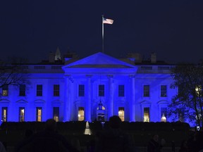 The White House in Washington is lit in blue Monday, April 2, 2018, in honor of World Autism Awareness Day.