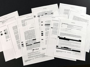 Copies of the memos written by former FBI Director James Comey are photographed in Washington, Thursday, April 19, 2018. President Donald Trump told former FBI Director James Comey that he had serious concerns about the judgment of his first national security adviser, Michael Flynn, according to memos maintained by Comey and obtained by The Associated Press. The 15 pages of documents contain new details about a series of interactions that Comey had with Trump in the weeks before his May 2017 firing. Those encounters include a White House dinner at which Comey says Trump asked him for his loyalty.