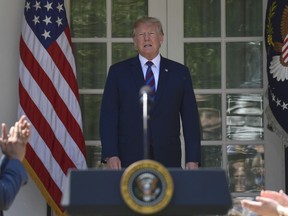 President Donald Trump walks into the Rose Garden of the White House in Washington, Thursday, April 12, 2018, to speak about tax policy.