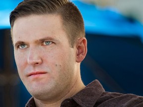 In this photo taken Nov. 18, 2016, Richard Spencer attends the largest white nationalist and Alt Right conference of the year, in Washington, D.C. A lawsuit over white nationalist Spencer's effort to speak at an Ohio college has been dropped. A federal court filing Wednesday, April 25, 2018, showed both Spencer's campus tour organizer and the University of Cincinnati have agreed to drop the case. No other details were available immediately. A trial had been scheduled for next year in U.S. district court.