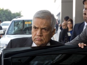 FILE- In this Nov. 22, 2017 file photo, Sri Lankan Prime Minister Ranil Wickremesinghe arrives at the Indira Gandhi International Airport in New Delhi, India. Sri Lanka's Parliament is debating a no-faith motion against Wickremesinghe on Wednesday, a move that threatens the unity government elected on a platform of good governance.