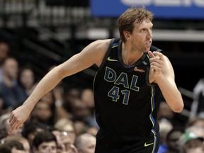 Dallas Mavericks' Dirk Nowitzki (41) celebrates sinking a 3-point basket in the second half of an NBA basketball game against the Portland Trail Blazers in Dallas, Tuesday, April 3, 2018.