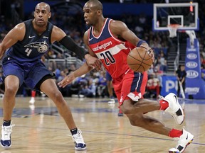 Washington Wizards' Jodie Meeks (20) drives around Orlando Magic's Arron Afflalo (4) during the first half of an NBA basketball game Wednesday, April 11, 2018, in Orlando, Fla.
