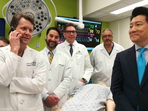This undated handout photo obtained April 23, 2018 courtesy of Johns Hopkins Medicine shows the medical team (left to right) Drs. Richard Redett, Trinity Bivalacqua, Brandacher Gerald, Arthur Bud Burnett and W.P. Andrew Lee, professor and director of plastic and reconstructive surgery at the Johns Hopkins University School of Medicine standing near a mannequin.