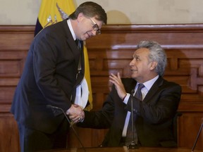 Ecuador's President Lenin Moreno, right, greets United States Ambassador Todd Chapman after a meeting where the ambassadors showed their support for Ecuador's government in view of the recent events on the border between Ecuador and Colombia, in Quito, Ecuador, Tuesday, April 17, 2018. Ecuadorean authorities say a dissident Colombian rebel group has kidnapped two people in the same border area where three press workers the group held were killed last week.