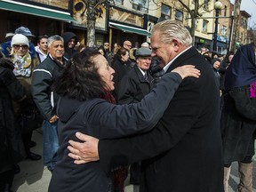 Ontario PC Leader Doug Ford greets a well-wisher during the St. Francis of Assisi Good Friday procession in Toronto, on March 30, 2018.