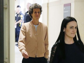 Andrea Constand, left, returns to the courtroom after a lunch break during Bill Cosby's sexual assault retrial at the Montgomery County Courthouse in Norristown, Pa., Monday, April 16, 2018.