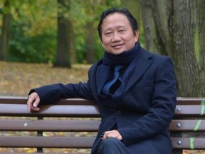 The undated image provided on Aug. 2, 2017 shows Trinh Xuan Thanh, a businessman and former functionary of Vietnam's Communist Party sitting on a park bench in Berlin, Germany. A Vietnamese man charged with involvement in the kidnapping of the former Vietnamese oil executive Trinh Xuan Thanh in Berlin has gone on trial in the German capital. The 47-year-old, identified only as Long N.H. because of German privacy rules, is charged with espionage and being an accessory to deprivation of liberty. Germany believes the kidnapping was a Vietnamese intelligence operation. (dpa via AP)