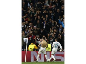 Real Madrid's Cristiano Ronaldo celebrates after scoring during a Champions League quarter final second leg soccer match between Real Madrid and Juventus at the Santiago Bernabeu stadium in Madrid, Wednesday, April 11, 2018.
