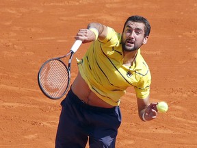 Croatia's Marin Cilic serves to Japan's Kei Nishikori during their quarterfinal match of the Monte Carlo Tennis Masters tournament in Monaco, Friday, April, 20, 2018.