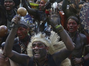 Indians participating in the "Free Land" camp make their displeasure known against the decision by the government of Brazil's President Michel Temer not to recognize the demarcation of the lands of the indigenous peoples living in Raposa Serra do Sol in Roraima State, during a protest in Brasilia, Brazil, Wednesday, April 25, 2018. Hundreds of indigenous Brazilians are setting up camp in the nation's capital for a week of speeches, protests and celebrations as they lobby the government to protect their rights.