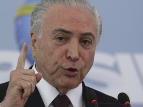 Brazil's President Michel Temer speaks at the Planalto Presidential Palace, in Brasilia, Brazil, Friday, April 27, 2018. President Temer has indignantly refuted accusations he has laundered money and says he will suggest that his minister of security investigate leaks to the media about the investigation. Authorities are investigating whether Temer accepted a bribe in exchange for a signing a decree favorable to operators at the country's largest port.