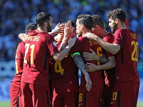 Roma players celebrate after their teammate Patrick Schick scored their side's third goal during a Serie A soccer match between Spal and AS Roma, at Paolo Mazza Stadium in Ferrara, Italy, Saturday, April 21, 2018.