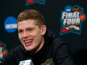 Michigan's Moritz Wagner answers questions during a news conference for the championship game of the Final Four NCAA college basketball tournament, Sunday, April 1, 2018, in San Antonio.